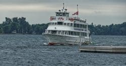 white boat on body of water at daytime